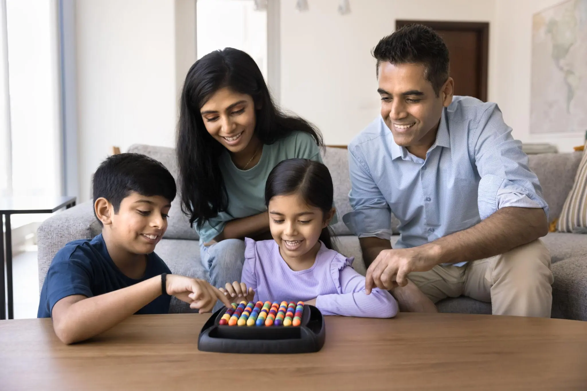 Child interacting with family at home