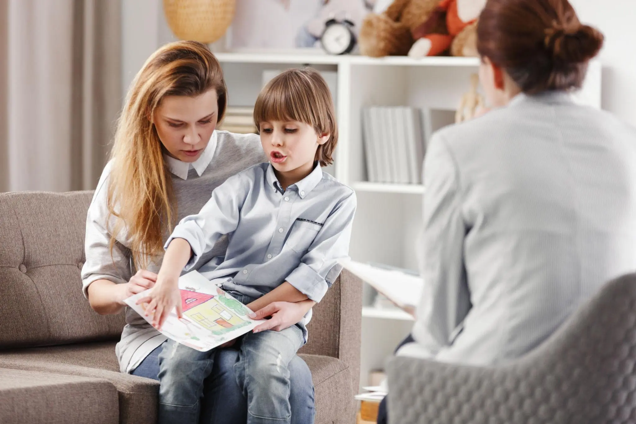 Mother attending therapy session with child